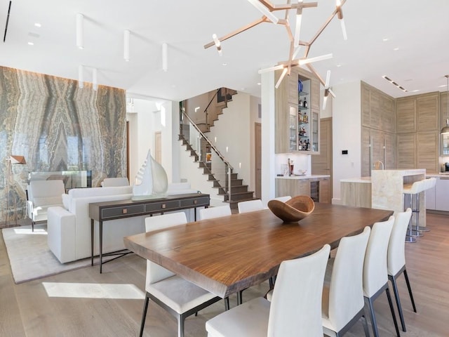 111 Mariner Beach Ln, Vero Beach, FL 32963 - dining area featuring light wood-style floors, stairs, and beverage cooler