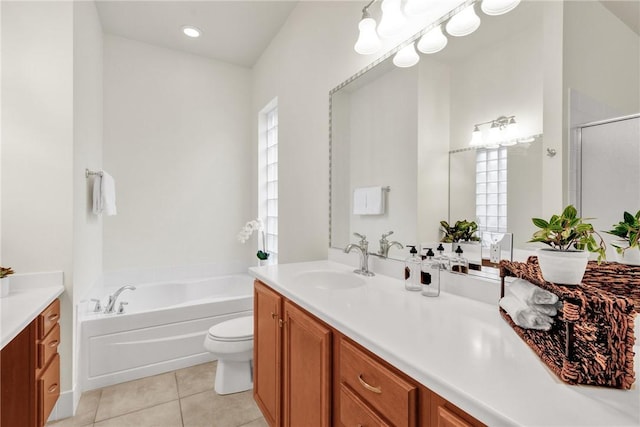 full bathroom featuring vanity, toilet, a wealth of natural light, and tile patterned flooring