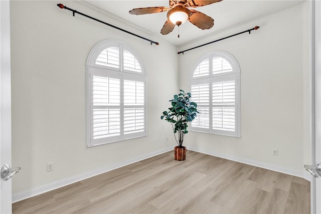 spare room featuring ceiling fan and light wood-type flooring