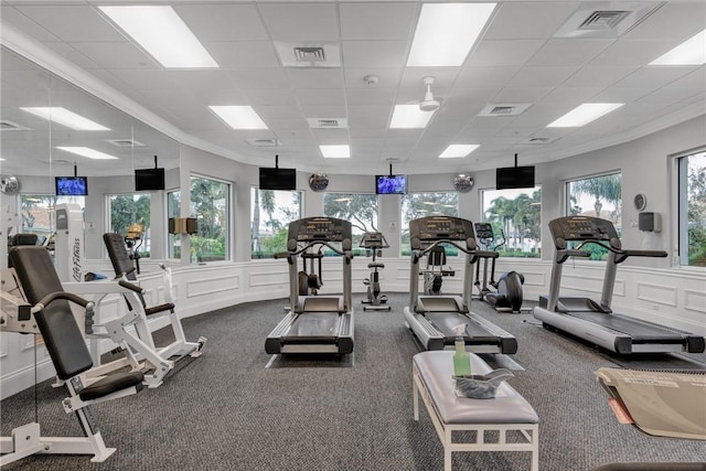 gym with carpet flooring and a paneled ceiling