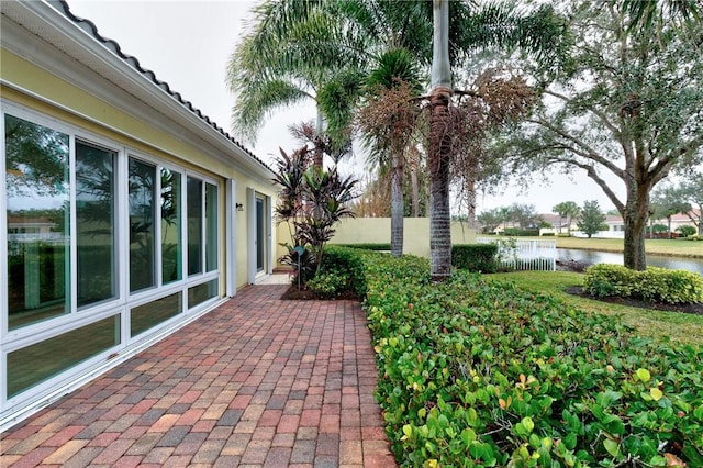 view of patio / terrace featuring a water view