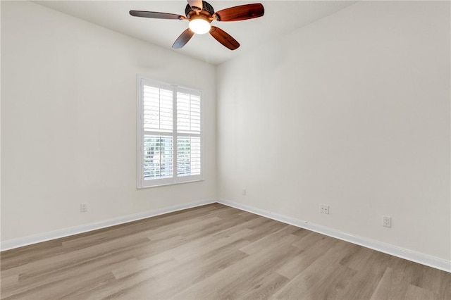 spare room with light hardwood / wood-style floors and ceiling fan