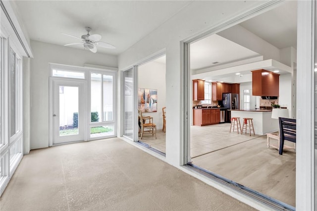 interior space featuring ceiling fan