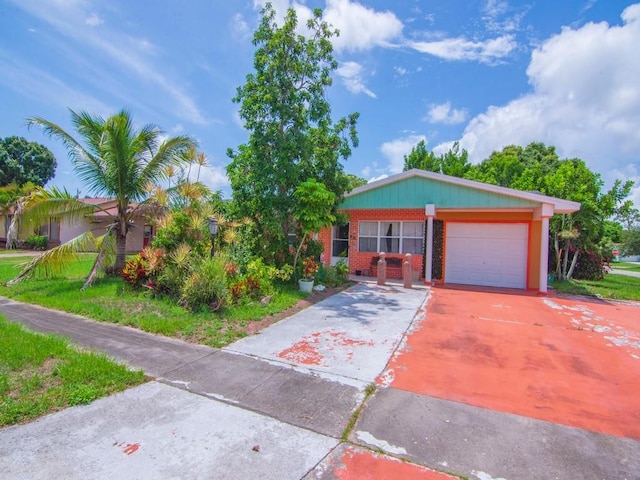 663 20th Pl SW, Vero Beach, FL 32962 - view of front of property with a garage, brick siding, and concrete driveway