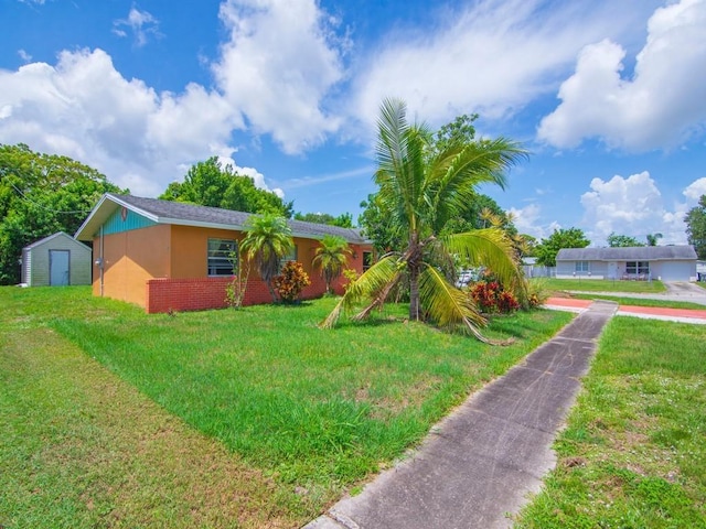663 20th Pl SW, Vero Beach, FL 32962 - single story home featuring a storage unit, a front yard, and stucco siding