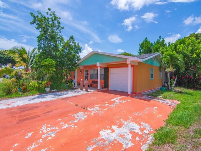 663 20th Pl SW, Vero Beach, FL 32962 - view of front of property with a garage and concrete driveway