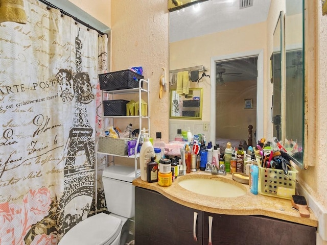 663 20th Pl SW, Vero Beach, FL 32962 - full bath with a textured wall, vanity, and a shower with curtain