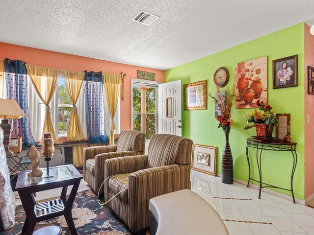663 20th Pl SW, Vero Beach, FL 32962 - living area featuring a textured ceiling and baseboards