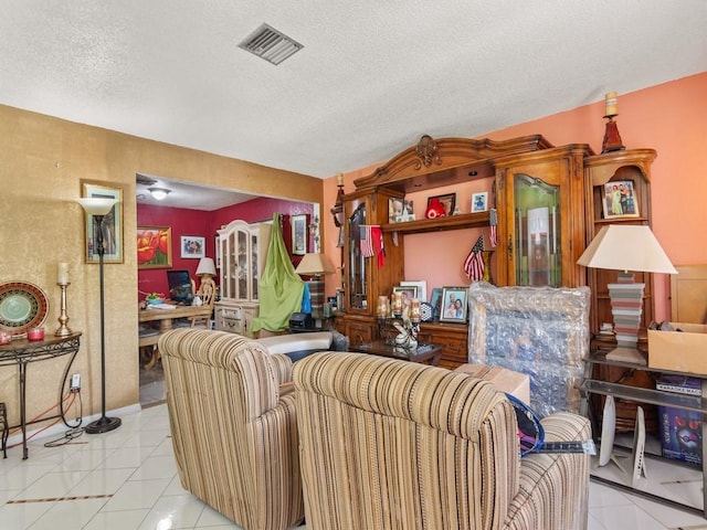 663 20th Pl SW, Vero Beach, FL 32962 - tiled living area featuring a textured ceiling