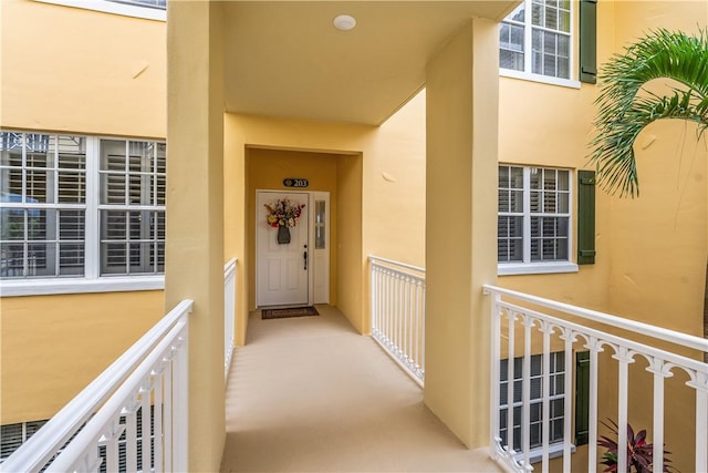 view of exterior entry featuring stucco siding