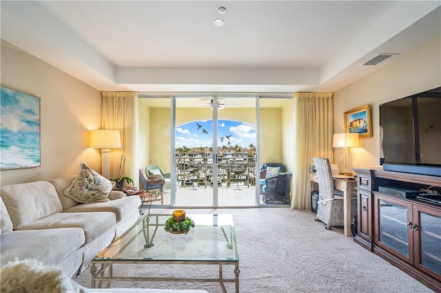 5520 N Harbor Village Dr Unit 203, Vero Beach, FL 32967 - living room featuring carpet flooring and a ceiling fan