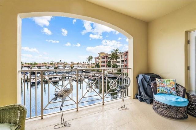 balcony featuring a water view