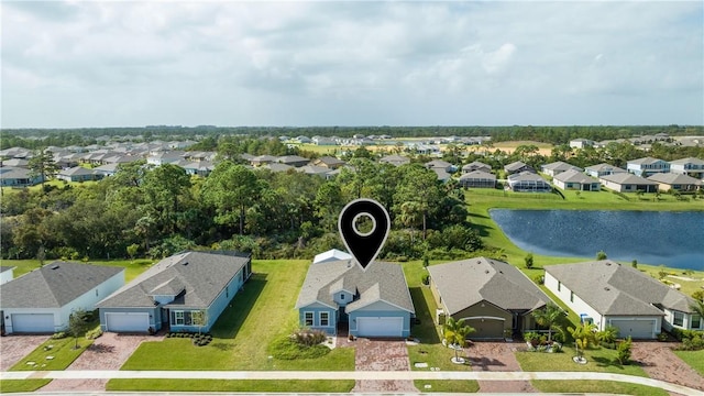 bird's eye view with a water view and a residential view