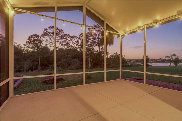 unfurnished sunroom with vaulted ceiling