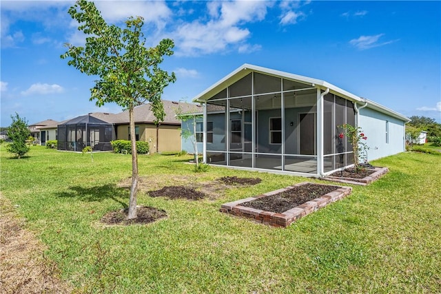 back of house featuring a yard