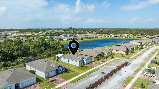 aerial view featuring a water view and a residential view