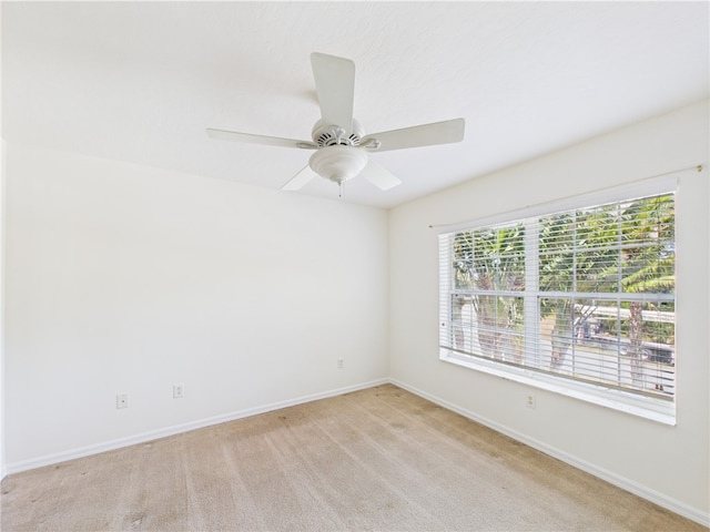 1458 Stonecrop St, Sebastian, FL 32958 - unfurnished room featuring baseboards, light colored carpet, and ceiling fan