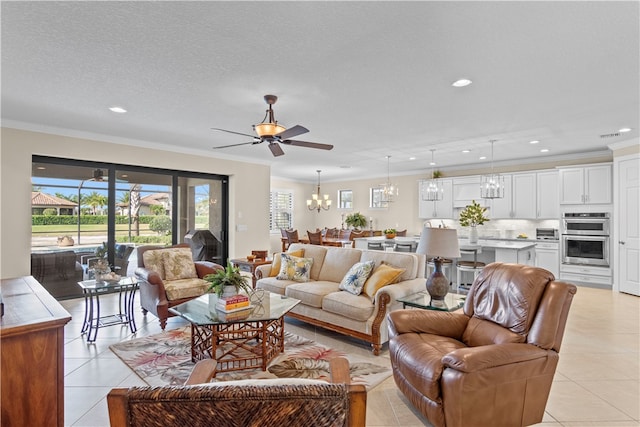 living room featuring a textured ceiling, ceiling fan with notable chandelier, light tile patterned flooring, and crown molding