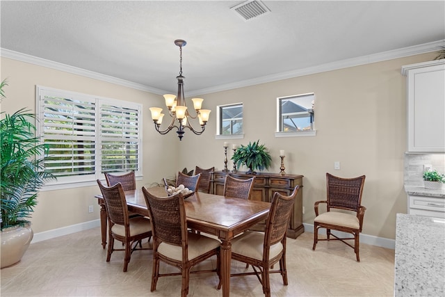 dining room featuring a notable chandelier and ornamental molding