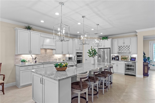 kitchen with white cabinets, stainless steel appliances, and wine cooler