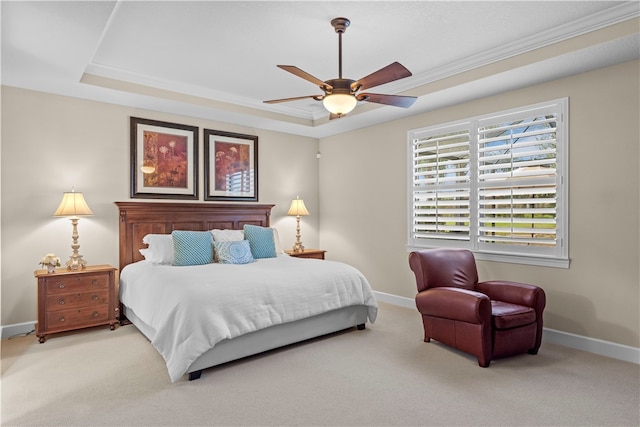 bedroom featuring crown molding, light carpet, ceiling fan, and a raised ceiling