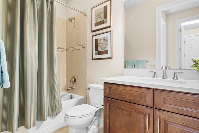 full bathroom featuring vanity, shower / bath combo, and toilet