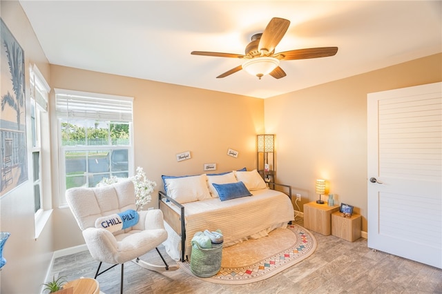 bedroom featuring ceiling fan and light hardwood / wood-style floors