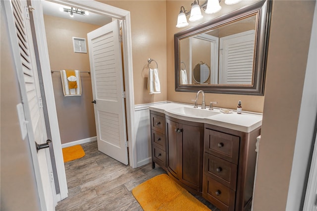 bathroom featuring vanity and wood-type flooring