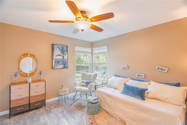 bedroom featuring hardwood / wood-style flooring and ceiling fan