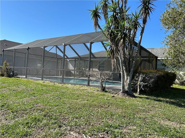 view of yard with a lanai and an outdoor pool