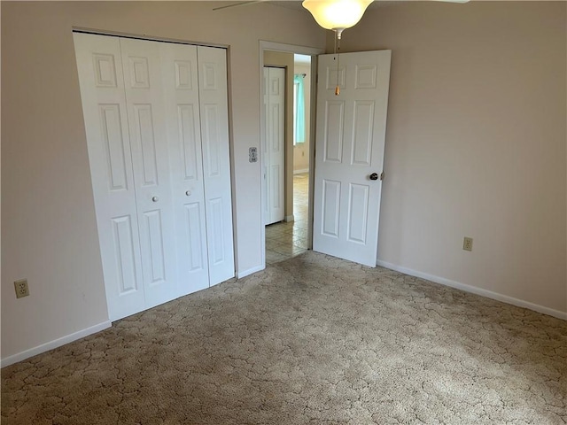 1080 Seamist Ln, Sebastian, FL 32958 - unfurnished bedroom with baseboards, carpet, a closet, and ceiling fan