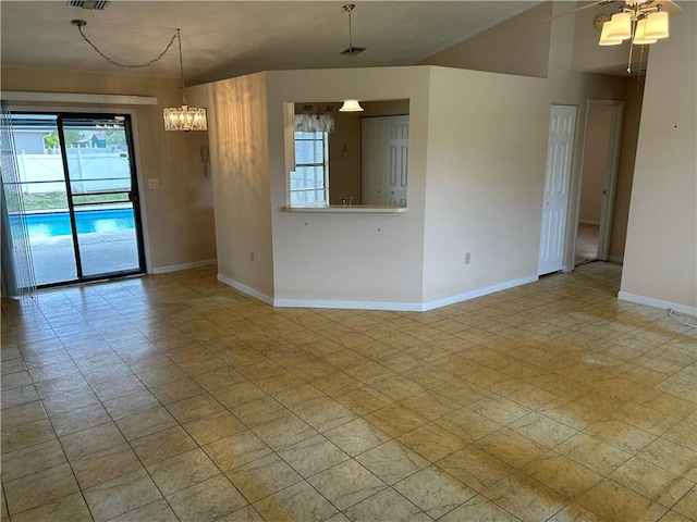 1080 Seamist Ln, Sebastian, FL 32958 - empty room with baseboards, visible vents, and ceiling fan with notable chandelier