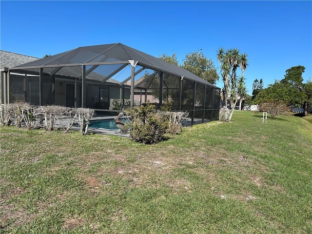 view of yard featuring a lanai and an outdoor pool