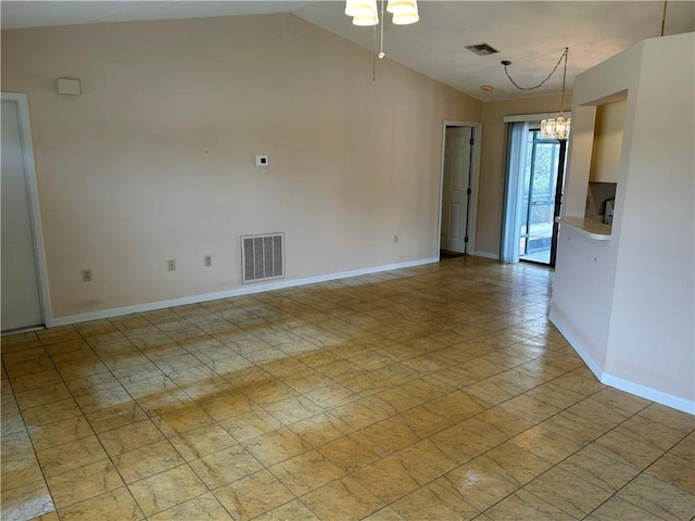 1080 Seamist Ln, Sebastian, FL 32958 - spare room featuring lofted ceiling, visible vents, baseboards, and a notable chandelier