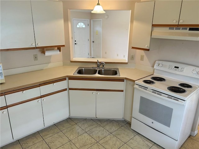 1080 Seamist Ln, Sebastian, FL 32958 - kitchen with white cabinets, under cabinet range hood, light countertops, a sink, and white appliances