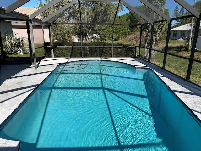 1080 Seamist Ln, Sebastian, FL 32958 - outdoor pool with glass enclosure and a patio