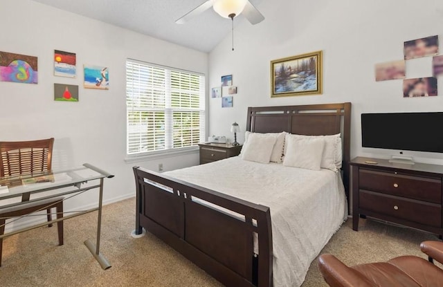 bedroom featuring ceiling fan, light colored carpet, and lofted ceiling