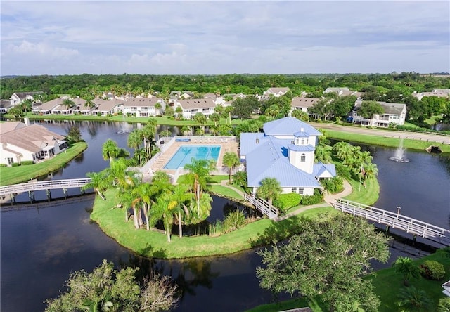 drone / aerial view with a residential view and a water view