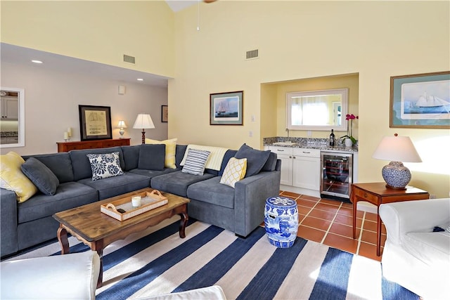 8367 Baytree Dr Unit 8367, Vero Beach, FL 32963 - living room with wine cooler and a towering ceiling