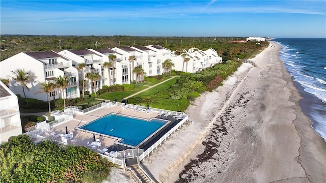 aerial view featuring a water view and a beach view