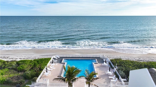 bird's eye view with a beach view and a water view