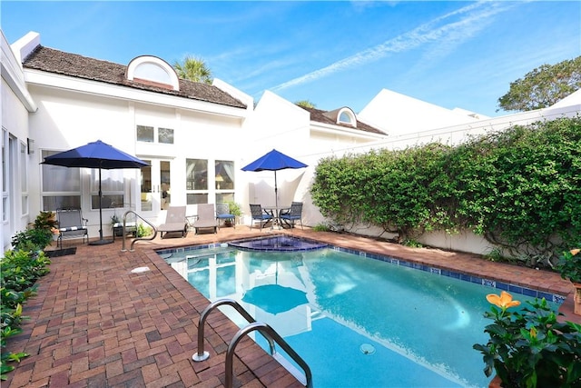 view of pool featuring a patio, a fenced backyard, and a fenced in pool