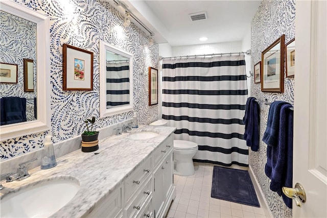 8367 Baytree Dr Unit 8367, Vero Beach, FL 32963 - full bath with tile patterned floors, double vanity, wallpapered walls, and a shower with curtain