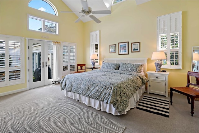 carpeted bedroom with high vaulted ceiling, access to outside, french doors, and ceiling fan