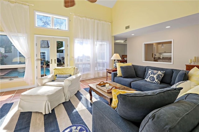 8367 Baytree Dr Unit 8367, Vero Beach, FL 32963 - tiled living room featuring a high ceiling and french doors