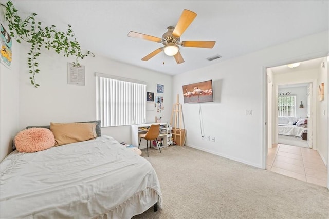 carpeted bedroom with ceiling fan