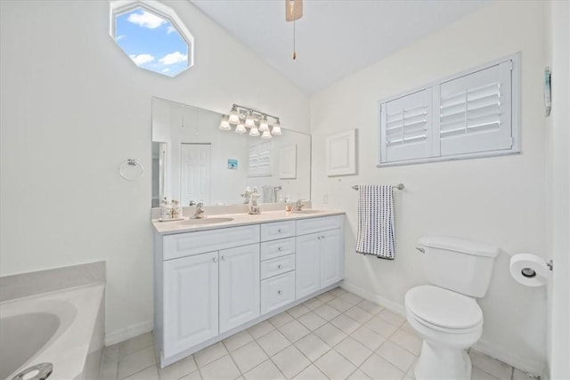 bathroom with toilet, a bathing tub, tile patterned flooring, vaulted ceiling, and vanity