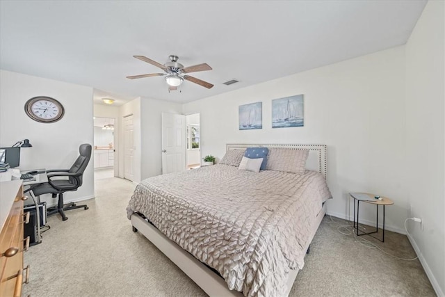 bedroom with ceiling fan and ensuite bath