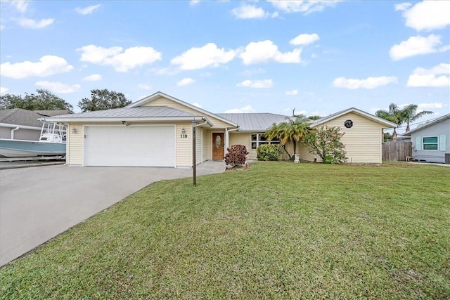 single story home with a front yard and a garage