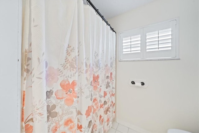 bathroom with tile patterned flooring